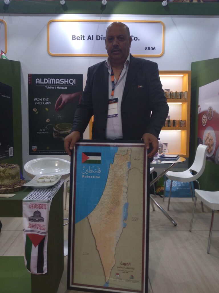 Beit Al Dimashqi exhibition stand with a map of Palestine